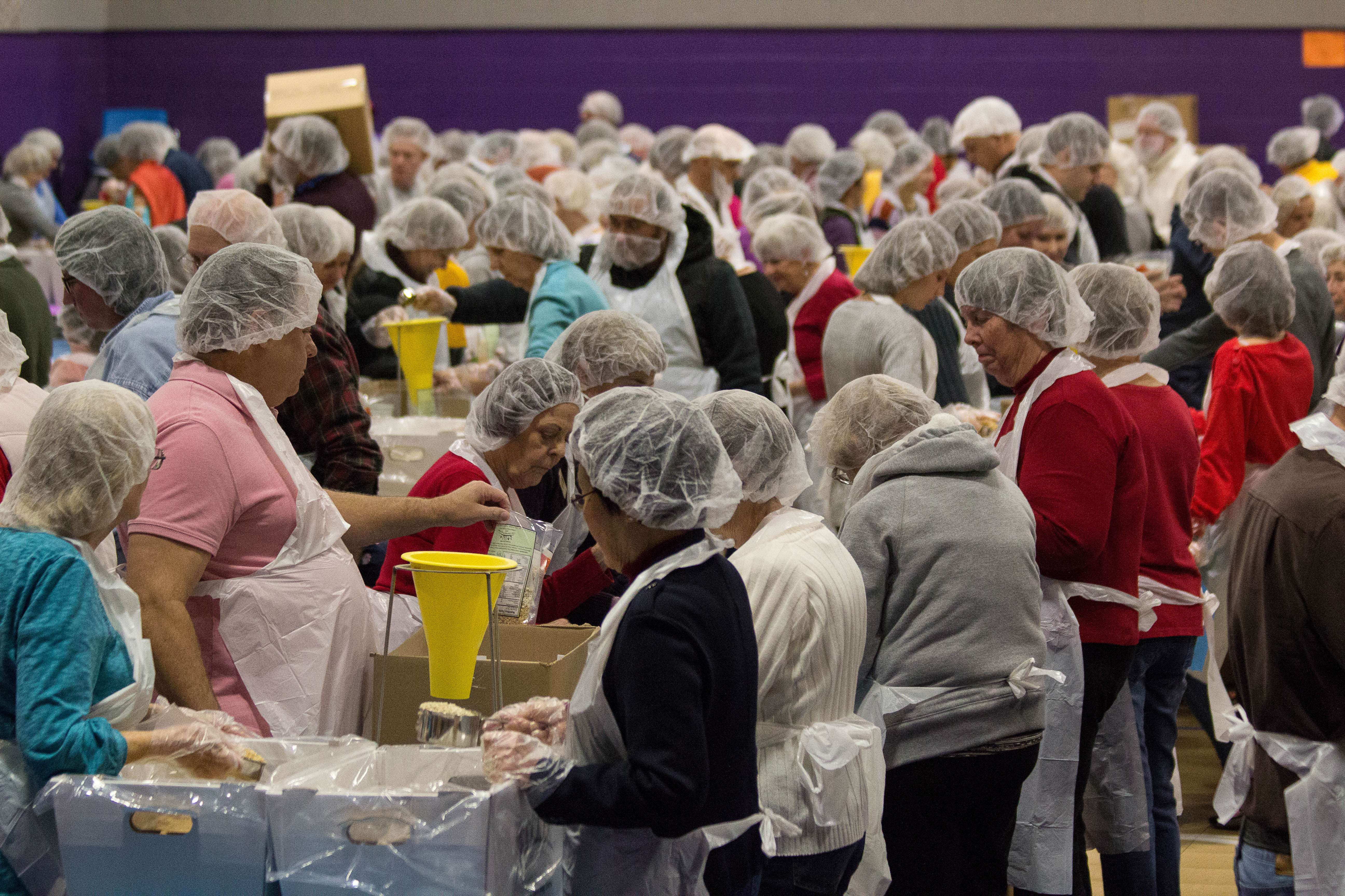 St. Paul's and community members pack meals for the hungry in Tucson.